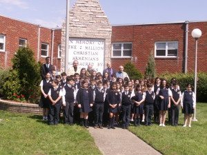 njschool Fourth to seventh graders of the Hovnanian School with members of the Armenian clergy in front of the Monument to the Armenian Genocide in Emerson.