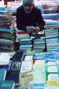 Making_best_Armenia_2 Vendor peddles his books at Vernisage, looking to eke out a living. (Photo by Tom Vartabedian)