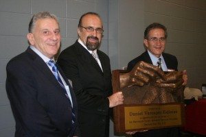 Replica of ‘A Mother’s Hands’ Genocide Memorial is presented to artistic designer Daniel Varoujan Hejinian, center, by Merimack Valley Armenian Monument Committee. Making the presentation were Chairman Armen Jeknavorian, left, and Dr. Ara Jeknavorian. (Tom Vartabedian Photo)