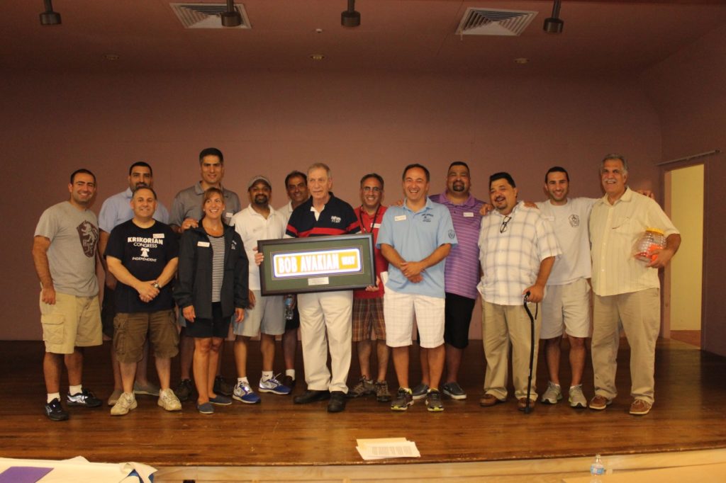 Honoree Bob Avakian with the 2014 Camp Haiastan Board of Directors and Liaisons. From left to right, Raffi Varjabedian, Levon Attarian, Steve Mesrobian, Michael Shamlian, Missie Simonian, Mike Gostanian, Ralph Kourtjian, Bob Avakian, Mike Bahtiarian, David Hamparian, Paul Horoian, Mark Alashaian, Adam Boyajian, and Peter Jelalian (Photo credit: Sevan Donoian)